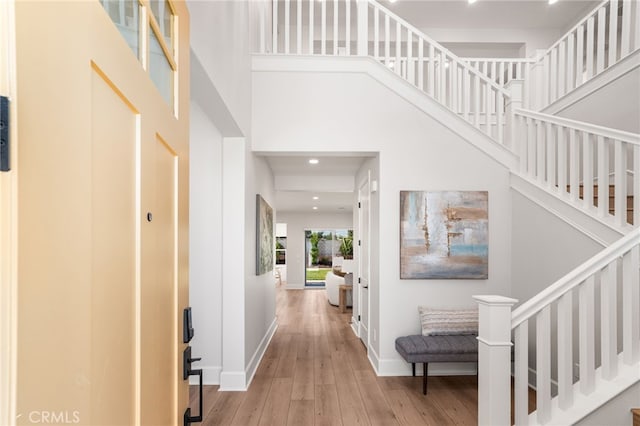 13428 Silver Sky Rd, Rancho Cucamonga, CA 91739 - entrance foyer featuring wood-type flooring, stairway, a towering ceiling, and recessed lighting