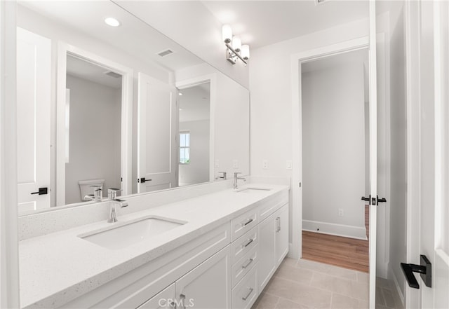 13428 Silver Sky Rd, Rancho Cucamonga, CA 91739 - full bath with double vanity, recessed lighting, and tile patterned floors