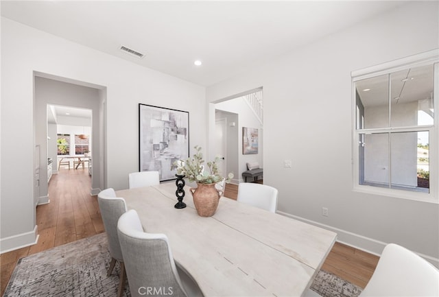 13428 Silver Sky Rd, Rancho Cucamonga, CA 91739 - dining space featuring wood finished floors and recessed lighting