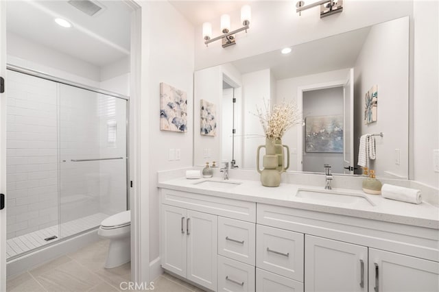 13428 Silver Sky Rd, Rancho Cucamonga, CA 91739 - bathroom with double vanity, a stall shower, tile patterned flooring, and recessed lighting