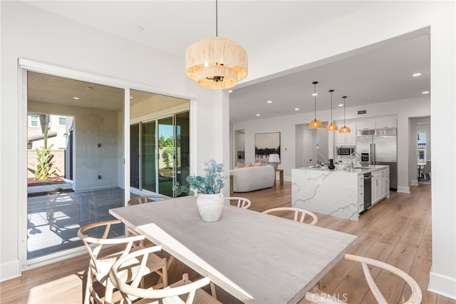 13428 Silver Sky Rd, Rancho Cucamonga, CA 91739 - dining room featuring light wood-style floors and recessed lighting