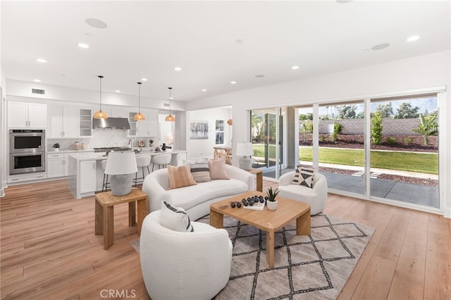 13428 Silver Sky Rd, Rancho Cucamonga, CA 91739 - living area with recessed lighting and light wood-style floors