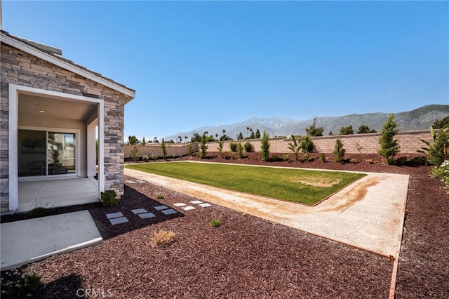 13428 Silver Sky Rd, Rancho Cucamonga, CA 91739 - view of yard featuring a mountain view and a patio area