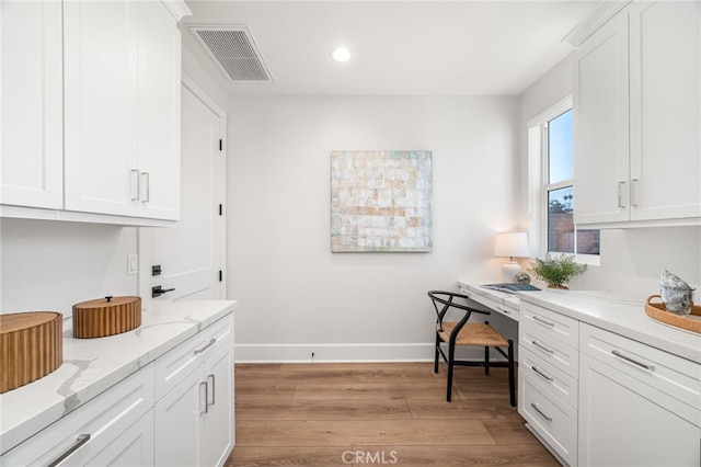 13428 Silver Sky Rd, Rancho Cucamonga, CA 91739 - laundry area featuring light wood finished floors, a desk, and recessed lighting