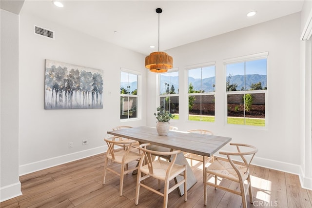 13428 Silver Sky Rd, Rancho Cucamonga, CA 91739 - dining area featuring light wood finished floors, a mountain view, and recessed lighting