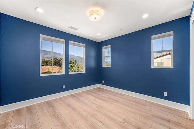 13428 Silver Sky Rd, Rancho Cucamonga, CA 91739 - unfurnished room with light wood finished floors, recessed lighting, and a mountain view