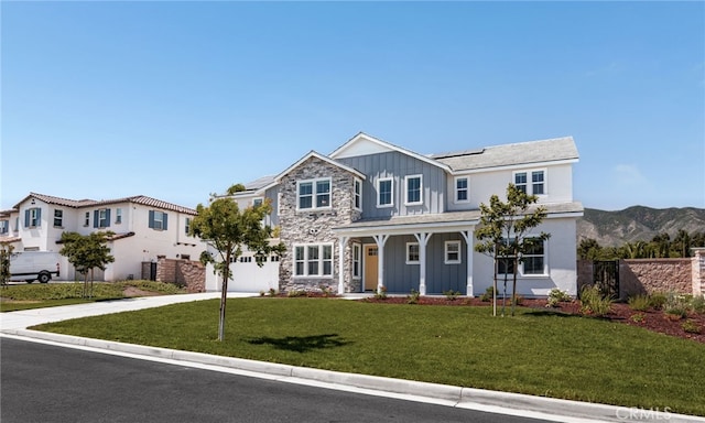 13428 Silver Sky Rd, Rancho Cucamonga, CA 91739 - view of front of property with board and batten siding, concrete driveway, solar panels, a garage, and stone siding