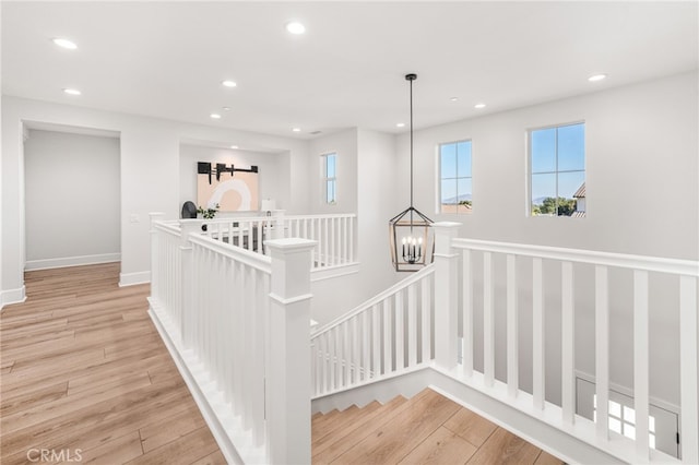 13428 Silver Sky Rd, Rancho Cucamonga, CA 91739 - corridor with an upstairs landing, recessed lighting, and light wood finished floors