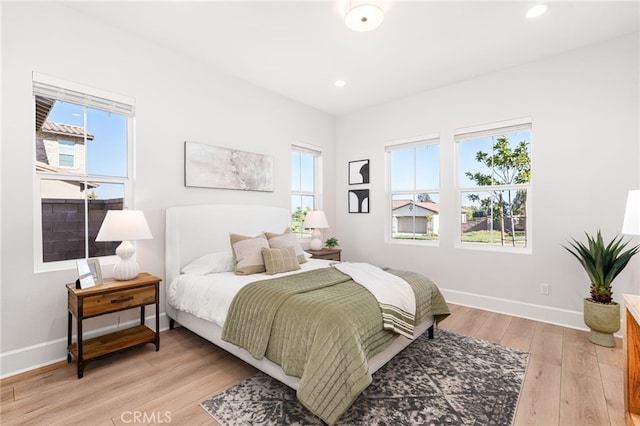 13428 Silver Sky Rd, Rancho Cucamonga, CA 91739 - bedroom with light wood-type flooring and recessed lighting