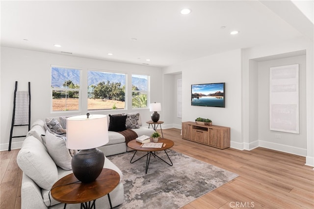 13428 Silver Sky Rd, Rancho Cucamonga, CA 91739 - living room with light wood-style flooring and recessed lighting
