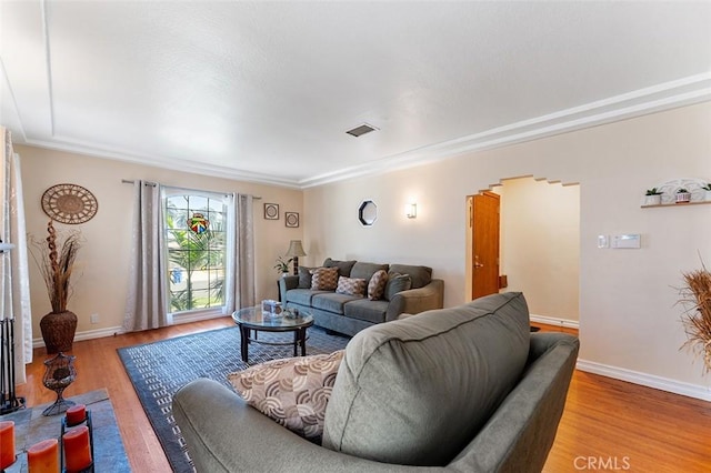 2118 W 84th St, Los Angeles, CA 90047 - living area with light wood-style flooring and ornamental molding