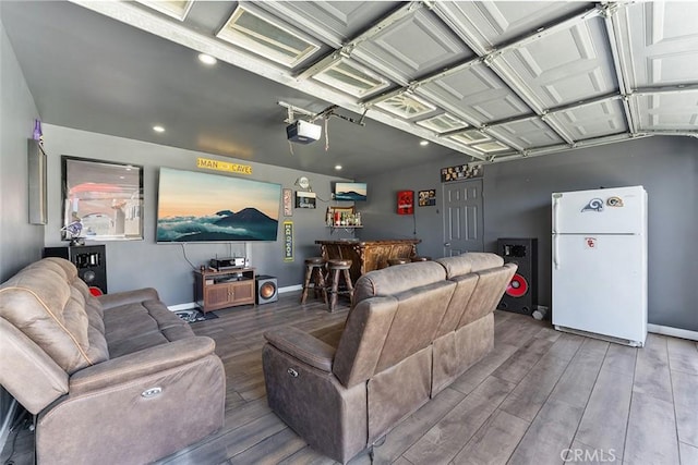 2118 W 84th St, Los Angeles, CA 90047 - living room with wood finished floors, a garage, a dry bar, and recessed lighting