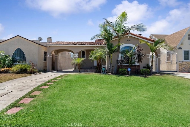 2118 W 84th St, Los Angeles, CA 90047 - mediterranean / spanish-style home with a gate, a front yard, stucco siding, and a tile roof