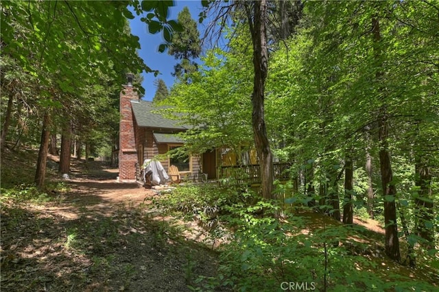 714 Blue Jay Canyon Rd, Lake Arrowhead, CA 92317 - rear view of property featuring a chimney
