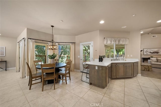 7105 Rayar Rd, Atascadero, CA 93422 - kitchen featuring light countertops, light tile patterned floors, recessed lighting, a chandelier, and decorative light fixtures