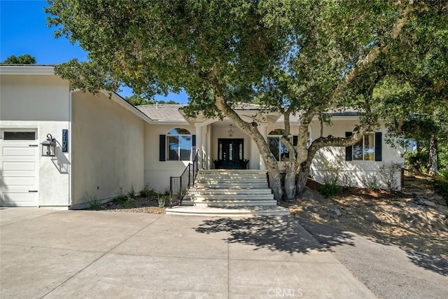 7105 Rayar Rd, Atascadero, CA 93422 - view of front facade with an attached garage, stucco siding, and concrete driveway