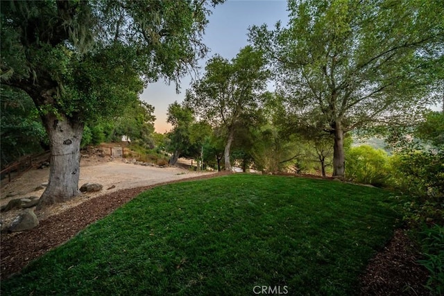 7105 Rayar Rd, Atascadero, CA 93422 - yard at dusk featuring a lawn