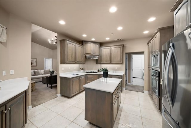 7105 Rayar Rd, Atascadero, CA 93422 - kitchen with stainless steel appliances, light countertops, recessed lighting, under cabinet range hood, and light tile patterned flooring