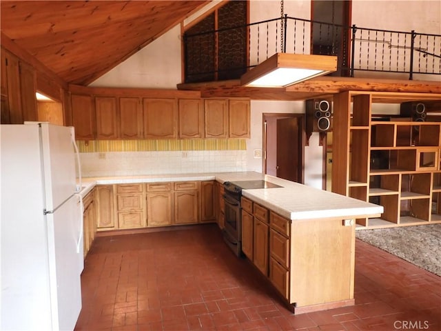 17216 Cedar Way, Clearlake Oaks, CA 95423 - kitchen with freestanding refrigerator, electric stove, brick flooring, light countertops, and a peninsula