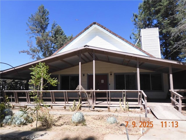 17216 Cedar Way, Clearlake Oaks, CA 95423 - view of front of home with a chimney and a tiled roof