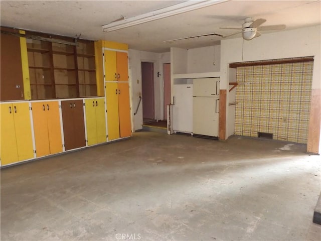 17216 Cedar Way, Clearlake Oaks, CA 95423 - unfurnished living room with unfinished concrete flooring, ceiling fan, and a garage
