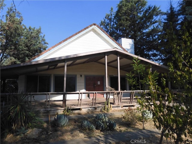 17216 Cedar Way, Clearlake Oaks, CA 95423 - country-style home featuring a tile roof and a chimney
