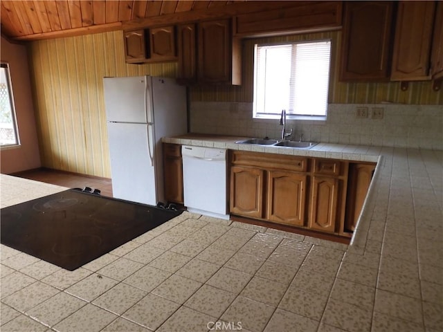 17216 Cedar Way, Clearlake Oaks, CA 95423 - kitchen with white appliances, tile counters, wood walls, wood ceiling, and backsplash