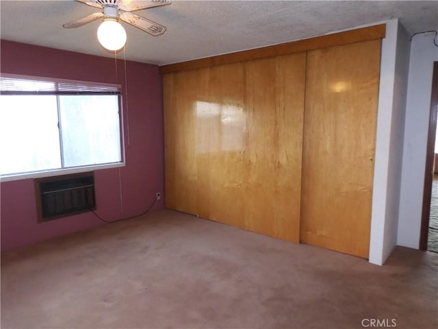 17216 Cedar Way, Clearlake Oaks, CA 95423 - carpeted spare room with ceiling fan, an AC wall unit, wood walls, and a textured ceiling