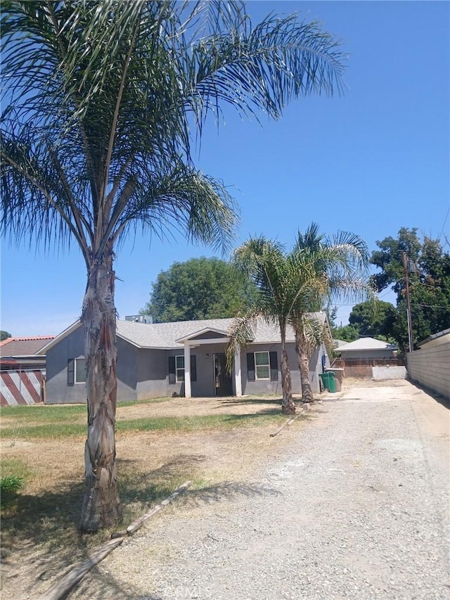 612 China Grade Loop, Bakersfield, CA 93308 - ranch-style house with driveway and stucco siding