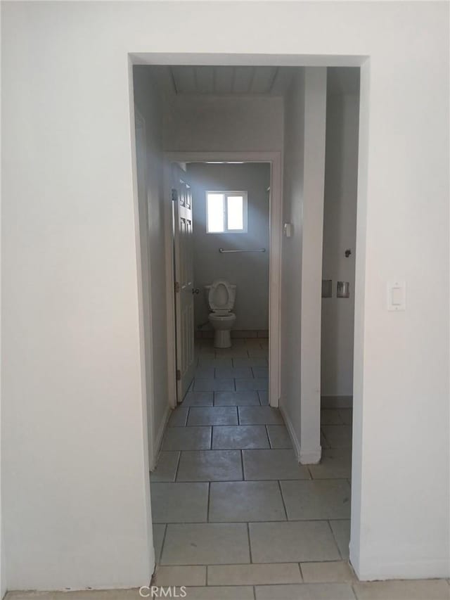 612 China Grade Loop, Bakersfield, CA 93308 - corridor featuring light tile patterned flooring and baseboards