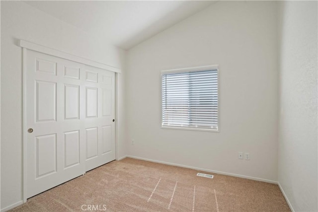 20128 Shadow Island Dr, Canyon Country, CA 91351 - unfurnished bedroom featuring light colored carpet, lofted ceiling, and a closet