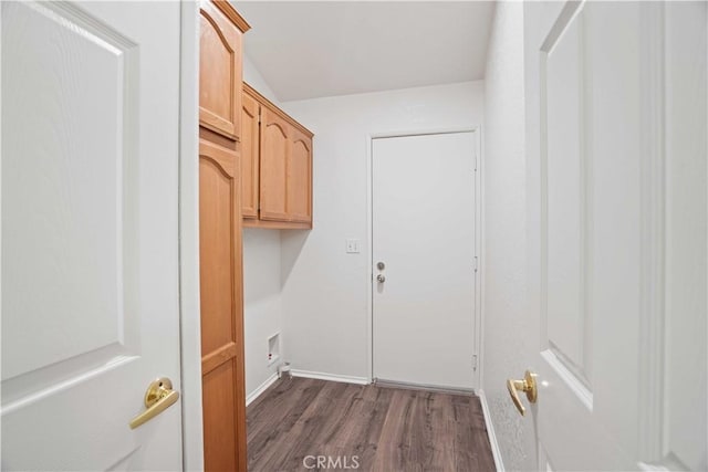 20128 Shadow Island Dr, Canyon Country, CA 91351 - washroom with dark wood-type flooring and baseboards