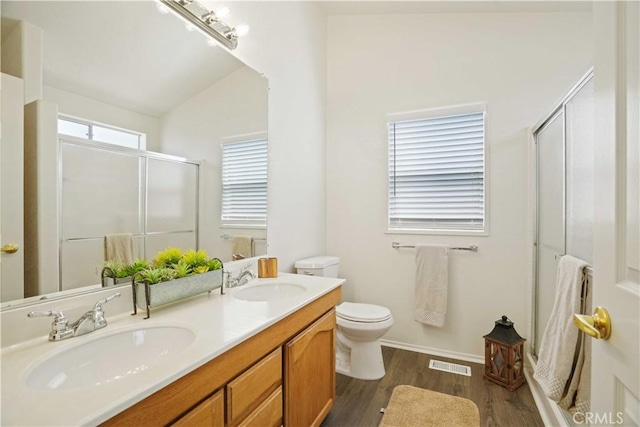 20128 Shadow Island Dr, Canyon Country, CA 91351 - bathroom with a shower with door, double vanity, wood finished floors, and lofted ceiling