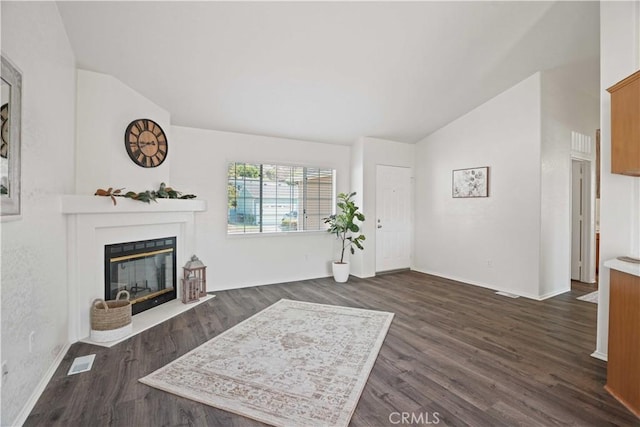 20128 Shadow Island Dr, Canyon Country, CA 91351 - living area featuring vaulted ceiling, dark wood finished floors, and a fireplace with flush hearth