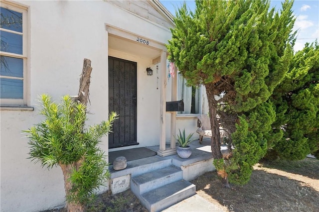2008 W 166th St, Torrance, CA 90504 - entrance to property with stucco siding and a porch