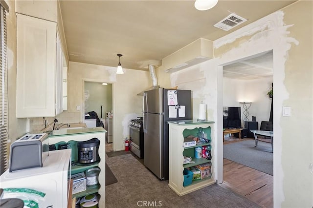 2008 W 166th St, Torrance, CA 90504 - kitchen featuring stainless steel appliances, white cabinets, dark colored carpet, and pendant lighting