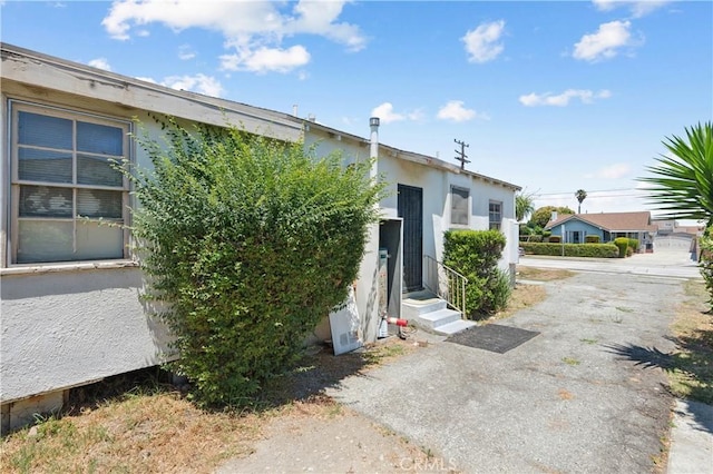 2008 W 166th St, Torrance, CA 90504 - view of property exterior featuring stucco siding and driveway