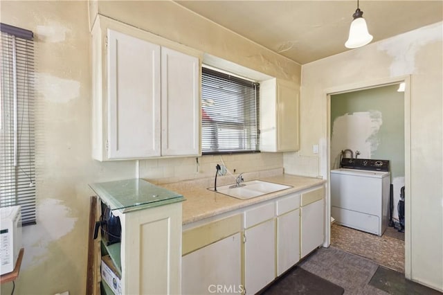 2008 W 166th St, Torrance, CA 90504 - kitchen with washer / clothes dryer, light countertops, white cabinets, and decorative light fixtures