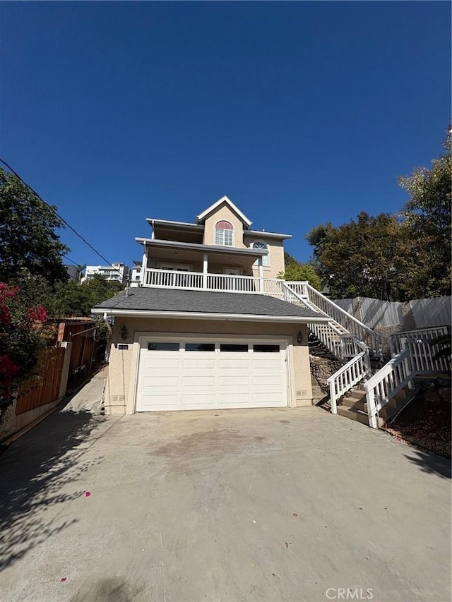 429 S Hill St, Orange, CA 92869 - view of front of home featuring stairway, concrete driveway, and stucco siding