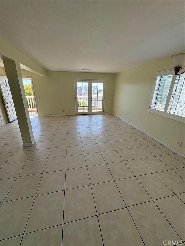 429 S Hill St, Orange, CA 92869 - spare room featuring french doors and light tile patterned floors