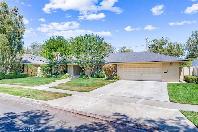 2117 N Westwood Ave, Santa Ana, CA 92706 - view of front of house featuring driveway, a garage, and stucco siding