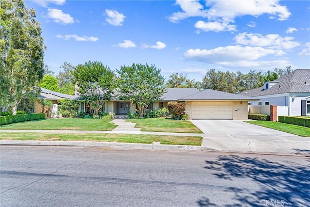 2117 N Westwood Ave, Santa Ana, CA 92706 - ranch-style house with an attached garage, concrete driveway, and stucco siding