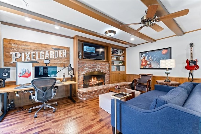 2117 N Westwood Ave, Santa Ana, CA 92706 - living room with a wainscoted wall, beamed ceiling, wood finished floors, ceiling fan, and a fireplace