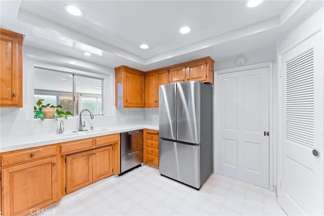 2117 N Westwood Ave, Santa Ana, CA 92706 - kitchen featuring stainless steel appliances, light flooring, tasteful backsplash, recessed lighting, and brown cabinets