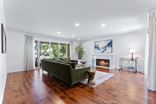 2117 N Westwood Ave, Santa Ana, CA 92706 - living room with wood finished floors, recessed lighting, a fireplace with flush hearth, and ornamental molding