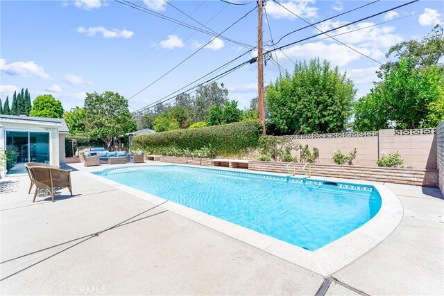 2117 N Westwood Ave, Santa Ana, CA 92706 - view of swimming pool with outdoor lounge area, a patio, and a fenced backyard