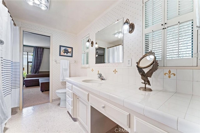 2117 N Westwood Ave, Santa Ana, CA 92706 - full bath featuring wallpapered walls, vanity, crown molding, and tasteful backsplash