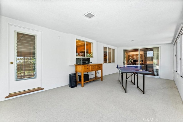 2117 N Westwood Ave, Santa Ana, CA 92706 - playroom featuring carpet floors, healthy amount of natural light, and a textured ceiling