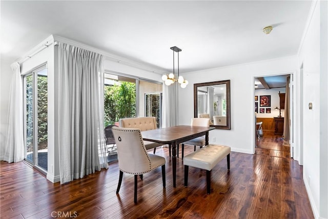 2117 N Westwood Ave, Santa Ana, CA 92706 - dining space featuring dark wood-style floors, a chandelier, and crown molding