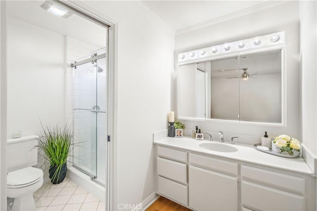 10601 Eton Ave, Chatsworth, CA 91311 - bathroom featuring a stall shower, vanity, ornamental molding, a ceiling fan, and tile patterned flooring